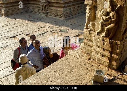 Tourists admiring the elegant and ornate Kalyana Mandapa Wedding Pavilion lovers in Vitthala Temple in Hampi, Karnataka, South India, India, Asia. Stock Photo