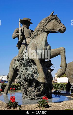 Statue of a guardian on a Camargue horse, Les Saintes-Maries-de-la-Mer, Camargue, Bouches-du-Rhone, Provence-Alpes-Cote d'Azur, Southern France Stock Photo
