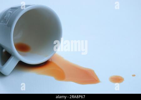 Coffee cup, spilled coffee, coffee stain, spilled coffee Stock Photo