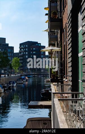Modern housing estate in Copenhagen, Denmark. A new district Sluseholmen with beautiful eco-friendly buildings at the channel Stock Photo