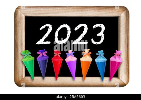 Colorful gifts and school chalk board 2023 isolated on white background Stock Photo