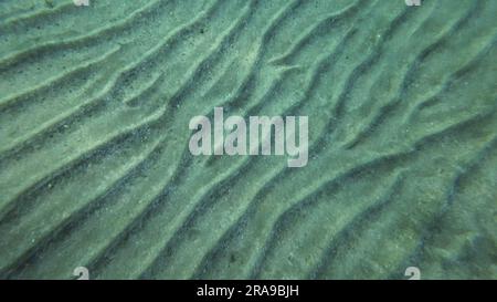 Sandy bottom covered with sand hills,  Natural background from the underwater depth, Red sea, Egypt Stock Photo