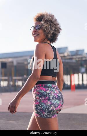 woman in sportswear smiling happy ready to run Stock Photo