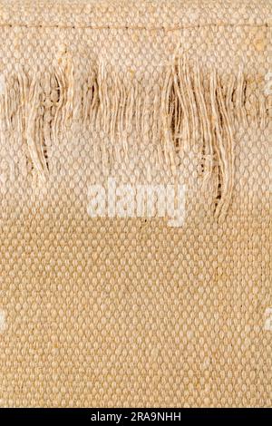 Close-up shot of worn seat fabric - appears to be mixed fibre not 100% cotton. For frayed edges, seen better days, out of condition metaphor. Stock Photo