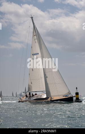 XoXo an Oyster 595 Sailing Yacht takes a close turn around the buoy at Bembridge on the final leg of the Isle of Wight Round The Island Yacht Race Stock Photo