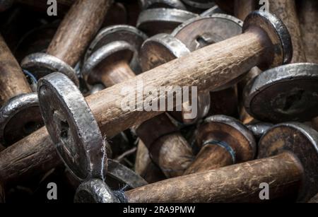 wooden spools for use on a hirstoric loom Stock Photo