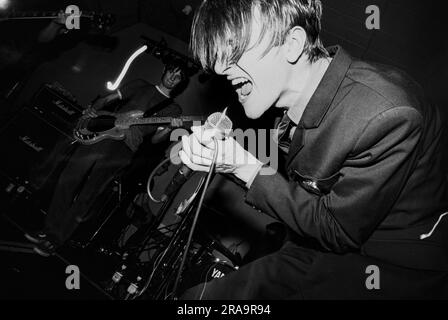 MENSWEAR, FIRST UK TOUR, 1995: Johnny Dean of the Britpop band Menswear playing live at Glamorgan University in Wales, UK on 4 May 1995. Photo: Rob Watkins.  INFO: Menswear is a British indie rock band that emerged during the 1990s Britpop era. Known for their stylish image and energetic sound, they gained attention with hits like 'Daydreamer' and 'Stardust,' blending jangly guitars with catchy, pop-infused melodies. Stock Photo