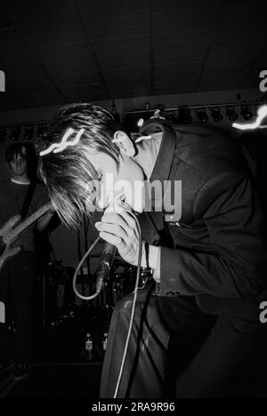 MENSWEAR, FIRST UK TOUR, 1995: Johnny Dean of the Britpop band Menswear playing live at Glamorgan University in Wales, UK on 4 May 1995. Photo: Rob Watkins.  INFO: Menswear is a British indie rock band that emerged during the 1990s Britpop era. Known for their stylish image and energetic sound, they gained attention with hits like 'Daydreamer' and 'Stardust,' blending jangly guitars with catchy, pop-infused melodies. Stock Photo