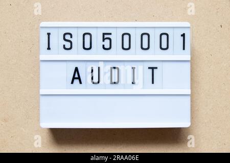 Lightbox with word ISO 50001 audit on wood background Stock Photo