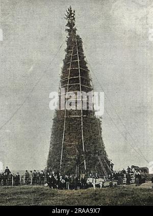 A superbly constructed bonfire at Whitehaven, 120 feet in height and 155 feet in circumference, containing 600 tons of timber and brushwood, 2000 gallons of petrol and with an air shaft specially constructed in the middle.  It was built in celebration of the coronation of King Edward VII.  Unfortunately, the king fell ill just two days before his coronation but it was lit anyway.     Date: 1902 Stock Photo