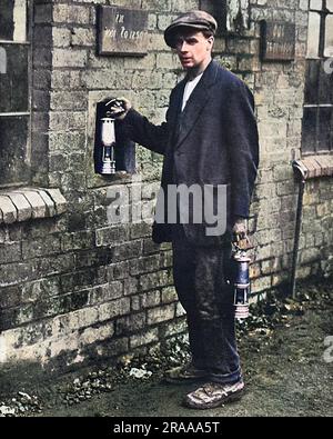 Staffordshire miner handing in his lamp before the October 16 coal strike. About one million miners went on strike in aid of wage increases.     Date: Oct-20 Stock Photo