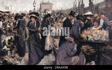 Shoppers viewing stalls of goods at the Caledonian Road Market, London, on a Friday in 1912. London society looking through china, houseware and clothes.     Date: 1912 Stock Photo