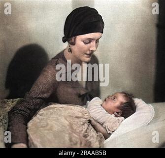 The Hon. Mrs Bryan Guiness (1910 - 2003), formerly Miss Diana Freeman Mitford, later Lady Mosley, pictured in 1930 with her eldest son, Jonathan Bryan Guinness.     Date: 1930 Stock Photo