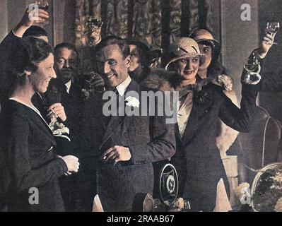 Guests at Grosvenor House toast Miss Amy Johnson, female aviator and fellow pilot, Jim Mollison, following their marriage at St. George's, Hanover Square, London in 1932.     Date: 1932 Stock Photo