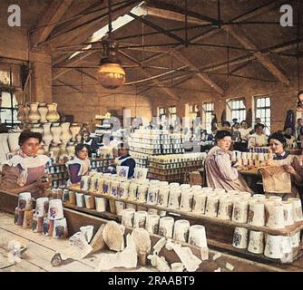 Women at the Royal Doulton Potteries at Burslem, photographed decorating and glazing the Coronation beakers to commemorate the Coronation of King  George V in 1911 and given to 100,000 children at the Crystal Palace fete on 30 June that year.     Date: 1911 Stock Photo