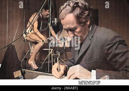 Dr. Griffith Pugh, leader of the British medical team for the 1968 Mexico Olympics, peforms high altitude tests, checking an athlete's heart readings during a five-minute 'race'. At 7415-feet Mexico City is one of the highest major cities in the world.     Date: 1966 Stock Photo