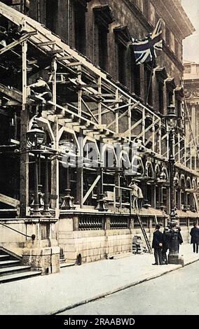 Special stands and viewing galleries being constructed on the front of the Reform Club in Pall Mall, London from where members and their families could watch the Coronation procession of King George V in June 1911.     Date: 1911 Stock Photo