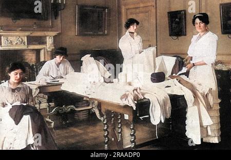 Viscountess Gladstone, along with the Hon. Lilian and Winifred Douglas Pennant (half -sisters of Lord Penrhyn) and Miss Poole working to provide garments and hospital dressings for the four London Territorial Base Hospitals being set up in the capital during the first few weeks of the First World War.     Date: 1914 Stock Photo