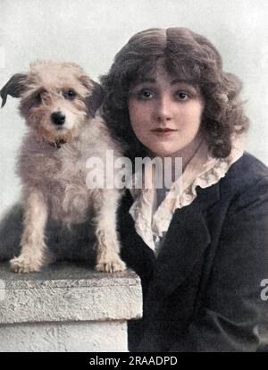 Miss Laurette Taylor (1883-1946) American actress born Loretta Helen Clooney. She appeared in one of the most popular shows of the First World War in London, Peg O' My Heart, written by her husband J Hartley Manners. Pictured with Michael, one of the canine stars of the show, who according to The Tatler went missing for a while but was soon returned.     Date: 1915 Stock Photo