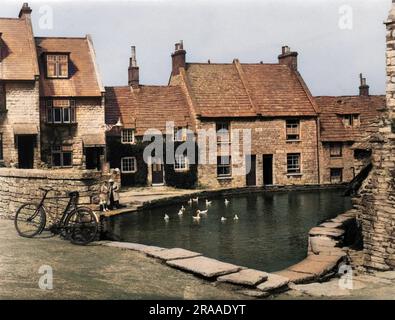 A lovely tranquil scene, with ducks on the old mill-pond in the charming village of Swanage, Dorset, England.     Date: 1939 Stock Photo