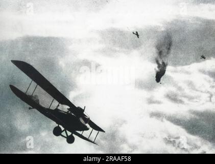 A French balloon shot down by a German aircraft during the First World War. The aircraft in the foreground is an Albatros C.V/17 (1917 model) with the elliptical lower mainplanes (very probably a montage with the Albatros added later).     Date: 1917-1918 Stock Photo