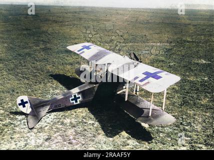 A German Rumpler-Taube two-seater plane during the First World War.  A crew member can be seen in the gunner's seat, holding a rifle.     Date: 1917-1918 Stock Photo