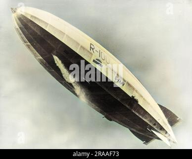 The British R100 airship in flight.  She was a rigid airship, designed by Barnes Wallis and built by Vickers for the UK Air Ministry, making her first flight on 16 December 1929.     Date: circa 1929 Stock Photo