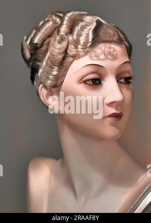 A tailor's dummy, head and shoulders, with wavy blonde hair and long eyelashes. Stock Photo