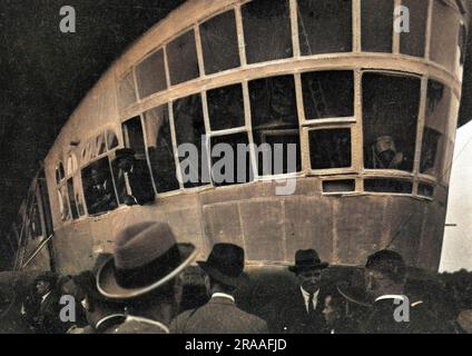 People in and around the German Graf Zeppelin airship. Seen here is a ...