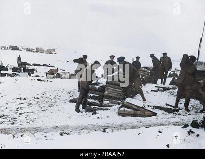 British artillerymen sorting shells in the snow on the Western Front during World War One.     Date: circa 1916 Stock Photo