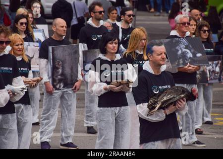 London, UK. 2nd July 2023. Animal rights activists from the group We Stand For The Animals staged a memorial at Marble Arch for the billions of animals exploited, abused and killed by humans for food, clothing, entertainment and other areas of human activity. The activists held pictures of various species as well as bodies of real animals, who died of natural causes, in remembrance of animals worldwide and in protest against speciesism. Credit: Vuk Valcic/Alamy Live News Stock Photo