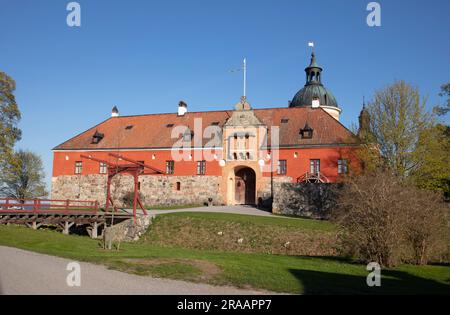 GRIPSHOLM CASTLE, SWEDEN ON MAY 12, 2023. View of the Main Entry, front. Park, flowers, moat, and drawbridge. Editorial use. Stock Photo