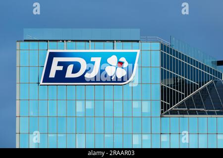 Sign and logo on the facade of the building housing the headquarters of Française Des Jeux (FDJ), the French operator of national lottery games Stock Photo