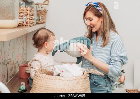 Mom showing her daughter stuffed shark toy Stock Photo