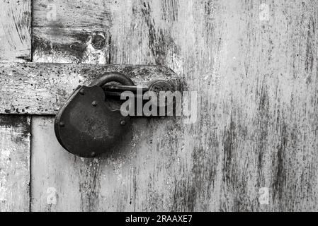 Old rusty lock on metal doors. Lock on the door with an empty place for an inscription Stock Photo