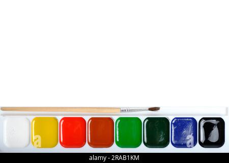 Paint brush and set of watercolor paints eight colors on white background Stock Photo