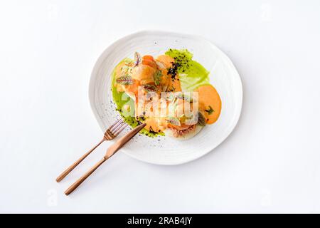Bao with pulled beef, pumpkin sauce and arugula Stock Photo