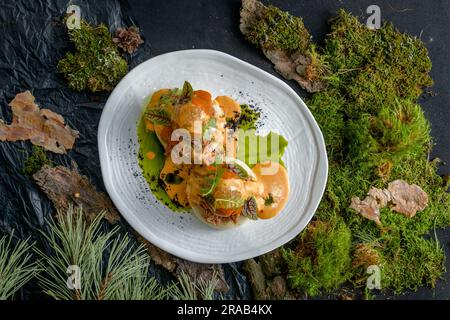 Bao with pulled beef, pumpkin sauce and arugula Stock Photo