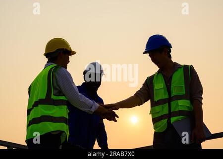 Engineers checking solar panels on solar power plant Stock Photo