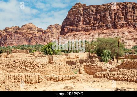 Al Ula ruined old town streets with palms along the road, Saudi Arabia Stock Photo