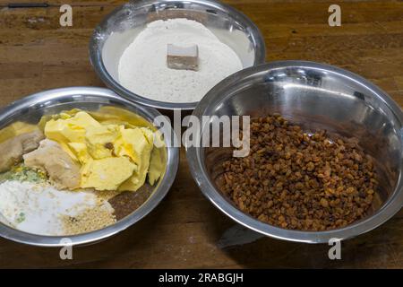 Production of an original Dresden Christstollen in Dresden, Germany. Each Dresden Stollen baker has his own recipe, which is based on the prescribed basic ingredients and yet contains little secrets in the spices or the exact mixing ratio Stock Photo