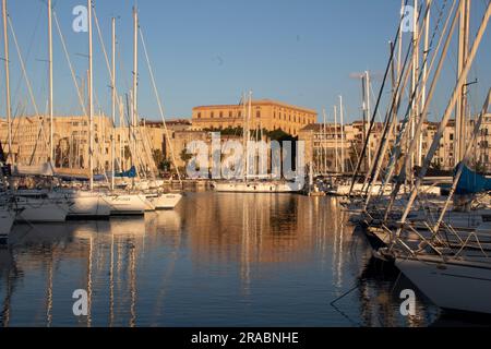 Yachts moored in the marina of Palermo harbour in the early evening light, Sicily Italy Stock Photo