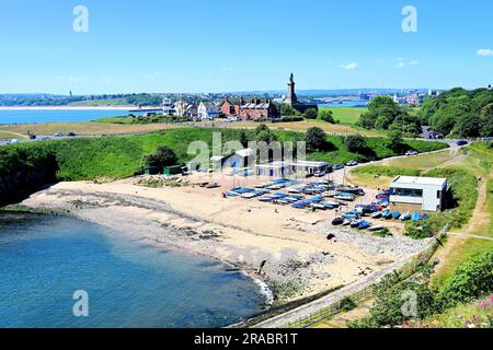 Priors Haven beach with the Tynemouth Sailing Club and the  Tynemouth Rowing Club the Spanish Battery and Collingwoods   monument in the background Stock Photo