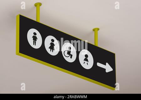 Public toilet sign with symbols and arrow showing direction Stock Photo