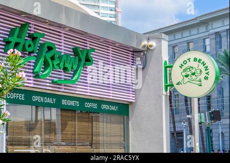 NEW ORLEANS, LA, USA - JULY 2, 2023: Hot Benny's Beignets and Coffee on Canal Street downtown Stock Photo