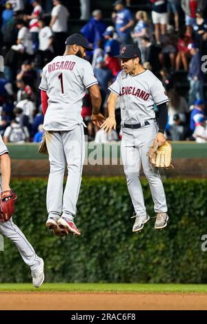 Cleveland Guardians' Amed Rosario (1) and Steven Kwan, right, celebrate  after defeating the Tampa Bay Rays in a wild card baseball playoff game,  Friday, Oct. 7, 2022, in Cleveland. (AP Photo/David Dermer