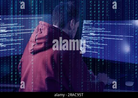 Anonymous man with computers and binary code Stock Photo