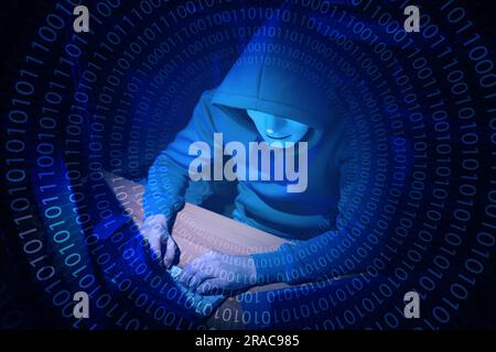 Anonymous man in mask with computer and binary code in darkness Stock Photo