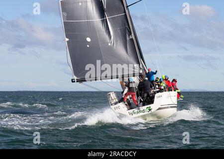 Large yachts are seen competing in Race 1 of the Winter Series held in choppy seas in Port Phillip Bay, Melbourne, Australia Stock Photo
