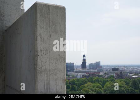 Hamburg, Germany. 01st June, 2023. The Elbphilharmonie (r) and Hamburg's main church Sankt Michaelis (Michel) can be seen from the structure on the roof of the elevated bunker on the Heiligengeistfeld. The greening and construction on the bunker at Heiligengeistfeld is to be completed this year. (to dpa-Korr: 'Gray bunker gets bigger and greener - planting is in full swing') Credit: Marcus Brandt/dpa/Alamy Live News Stock Photo